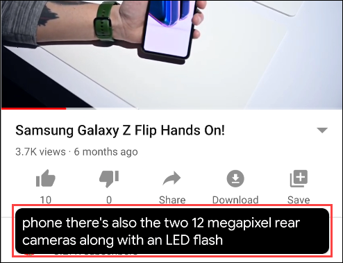 Un cuadro de texto Live Caption debajo de un video en YouTube.