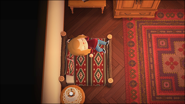 Un personaje durmiendo en una cama en "Animal Crossing: New Horizons".