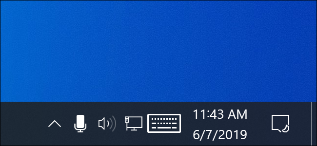 Icono de micrófono en el área de notificación de Windows 10