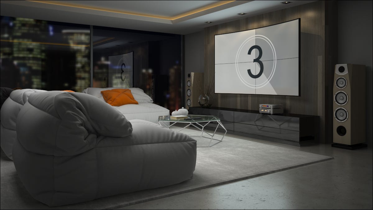 Una sala de estar moderna con un sistema de cine en casa