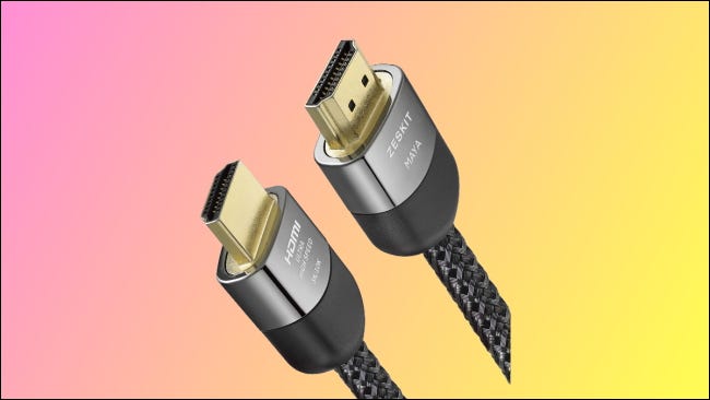 Cable HDMI Zeskit sobre fondo rosa y amarillo