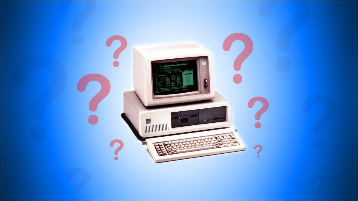 Una PC IBM con signos de interrogación a su alrededor sobre un fondo azul