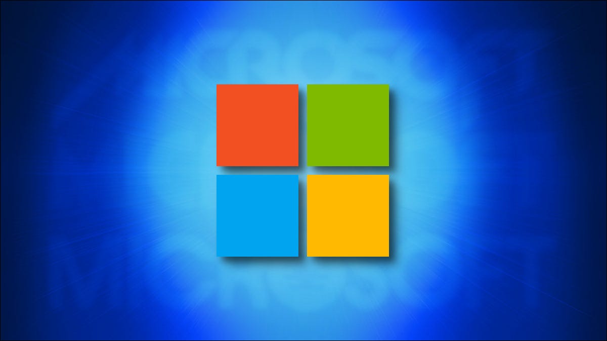 Los cuadrados del logotipo de Microsoft sobre un fondo azul oscuro con logotipos antiguos detrás